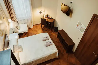 a living room with a couch and a desk at Ronda St. Angelo Suites in Rome