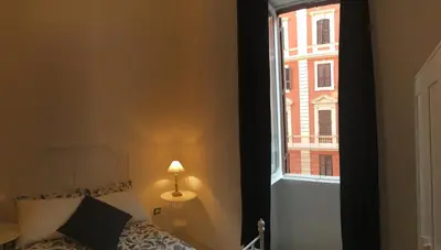 a hallway of a kitchen with a chandelier at MiRhome Guest House in Rome
