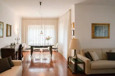 a living room with a table and a couch at Plumbird Boutique & Apartment in Rome