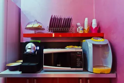 a kitchen with a microwave and a toaster oven at Dream Station in Rome