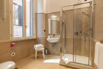 a bathroom with a shower and a sink at I TRE MOSCHETTIERI - D'ARTAGNAN Luxury Guest House in Rome