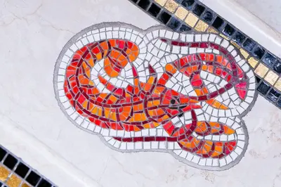 a mosaic sign on top of a tiled floor at Hotel Celio in Rome
