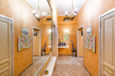 a bathroom with orange walls and a large mirror at Affittacamere Guest House Glatimia in Rome