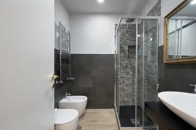 a bathroom with a toilet and a sink and a shower at Interno 9 a San Pietro in Rome