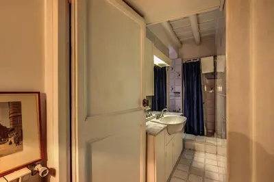 a bathroom with a sink and a toilet and a mirror at Magenta Collection Egidio in Rome