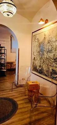 a room with a glass table and a painting on the wall at DCBoutiqueHotel in Rome