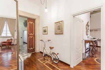a bike parked in a room with a living room at Palazzo Del Duca Piazza Navona Campo dei Fiori Piazza del Fico Guest House in Rome