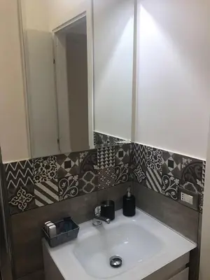a bathroom with a sink and a mirror at Angolo di Roma Guest house in Rome