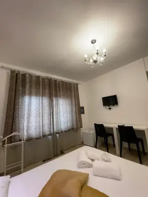 a bedroom with a bed with two towels on it at Rome Sweet Home Vatican in Rome