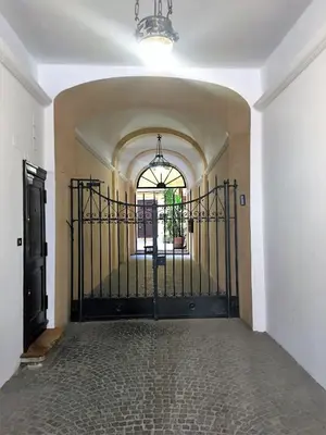 a hallway with a black gate in a house at Behind Navona in Rome