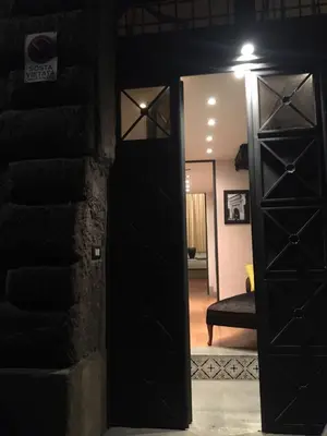 a door leading into a living room with a mirror at Magenta Collection Specchi in Rome