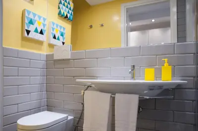 a bathroom with a sink and a toilet at Secret Rhome Loft in Rome