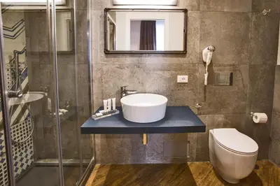 a bathroom with a sink and a toilet at Ara Suite in Rome