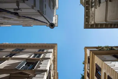 a view of the sky between two buildings at Frankie Charme in Rome
