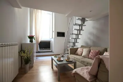 a living room with a couch and a table at Frankie Charme in Rome