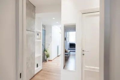 a hallway with a white door and a room at Frankie Charme in Rome