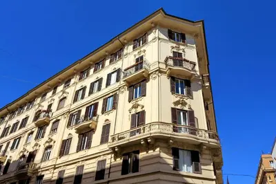 a tall building with balconies on the side of it at Prestigious Apartment Via Veneto in Rome