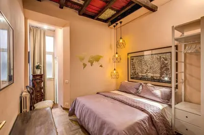 a bedroom with a bed in a room at Governo Vecchio in Rome