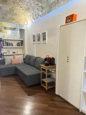 a living room with a couch and a table at The Ancient Wall in Rome