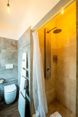 a bathroom with a shower and a toilet at My Tiny Home in Rome