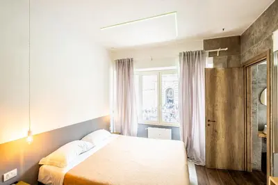 a bedroom with a bed and a window at My Tiny Home in Rome