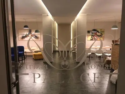 a dining room with a table and chairs at Patrizia Romana Palace in Rome