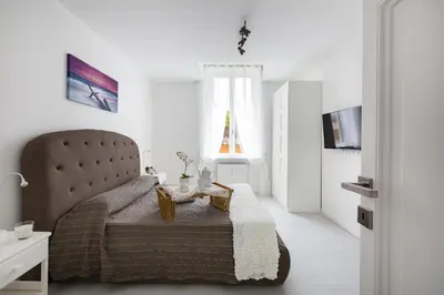a bedroom with a bed with a table on it at The Imperial Suite in Rome