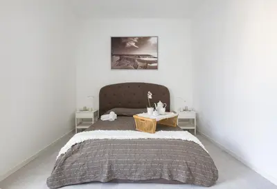a bedroom with a bed and two tables at The Imperial Suite in Rome