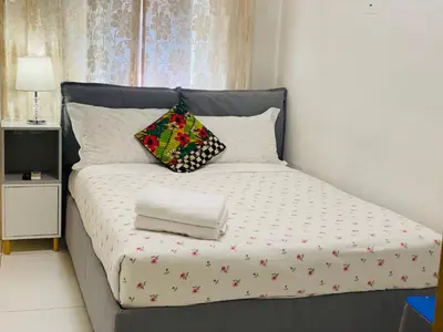 a bed with two pillows on top of it at I Dormienti in Rome