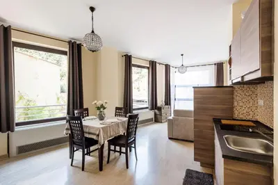 a kitchen and dining room with a table and chairs at Casa Sangallo in Rome