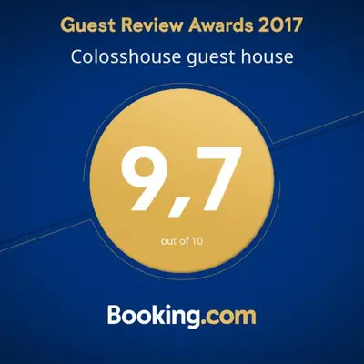 a sign that reads guest review awards coloss house guest house at Colosshouse guest house in Rome