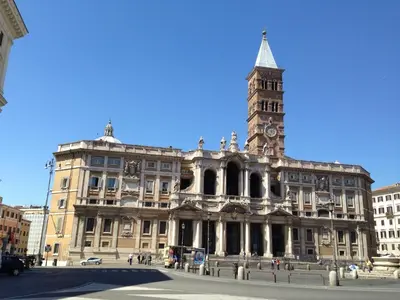 a large building with a clock tower on top of it at Colosshouse guest house in Rome