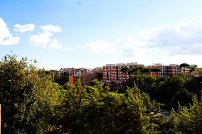 a view of a city with buildings and trees at By Grace in Rome