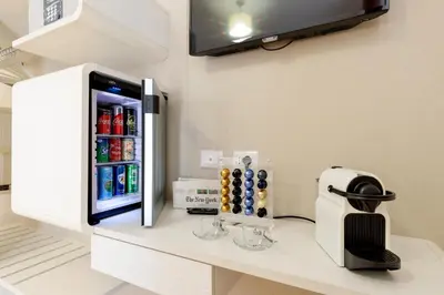 a refrigerator freezer sitting on top of a counter at Dolce Luxury Rooms in Rome
