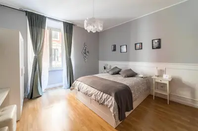a white bedroom with a bed and a window at Monti49 GuestHouse in Rome