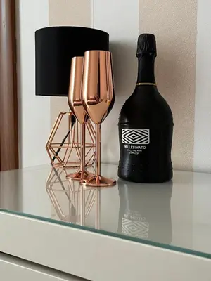 a bottle of wine and two wine glasses on a table at Monti49 GuestHouse in Rome