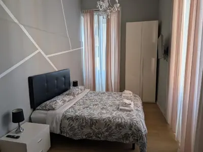a bedroom with a bed and a dresser and a bed sidx sidx at El Dorado Vatican in Rome
