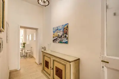 a room with a painting on the wall at GuestHouse o Affittacamere Casa Fienaroli 2 in Rome