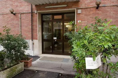 an entrance to a brick building with a glass door at Vatican's Sight in Rome