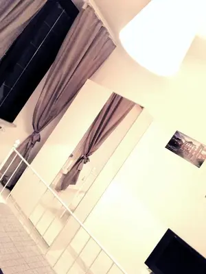 a room with brown curtains and a window at Rhome Sweet Rhome in Rome
