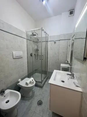 a bathroom with a sink and a toilet and a shower at Ponte Milvio - Flat with terrace in Rome