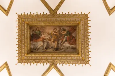 a painting in a gold frame on a wall at Experience Collection by ROMAC - Costaguti Experience in Rome