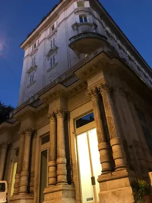 a building with columns on the side of it at Sweethome Crispi in Rome