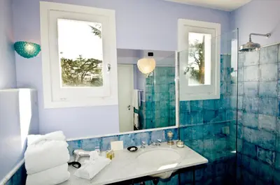 a bathroom with a sink and a mirror at Hotel Villa Linneo in Rome