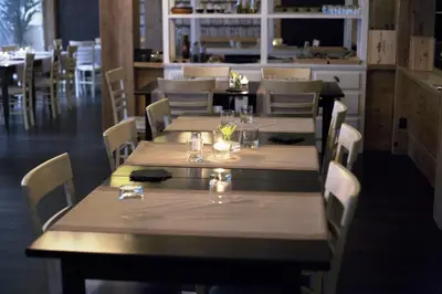 a dining room with wooden tables and chairs and a restaurant at Lungotevere Suite in Rome