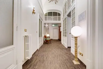 a hallway with white walls and a white ceiling at Affreschi Su Roma Luxury B&B in Rome
