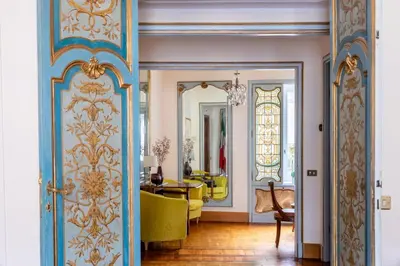 a room with a door and a dining room at Martina House in Rome