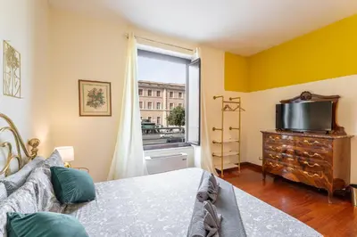 a bedroom with a bed and a window at BigFamilyRome - Vatican & Navona in Rome