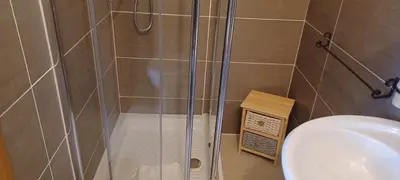 a shower in a bathroom with a toilet and a sink at Vatican View Rooms in Rome
