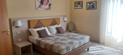 a bedroom with a bed in a room at Vatican View Rooms in Rome